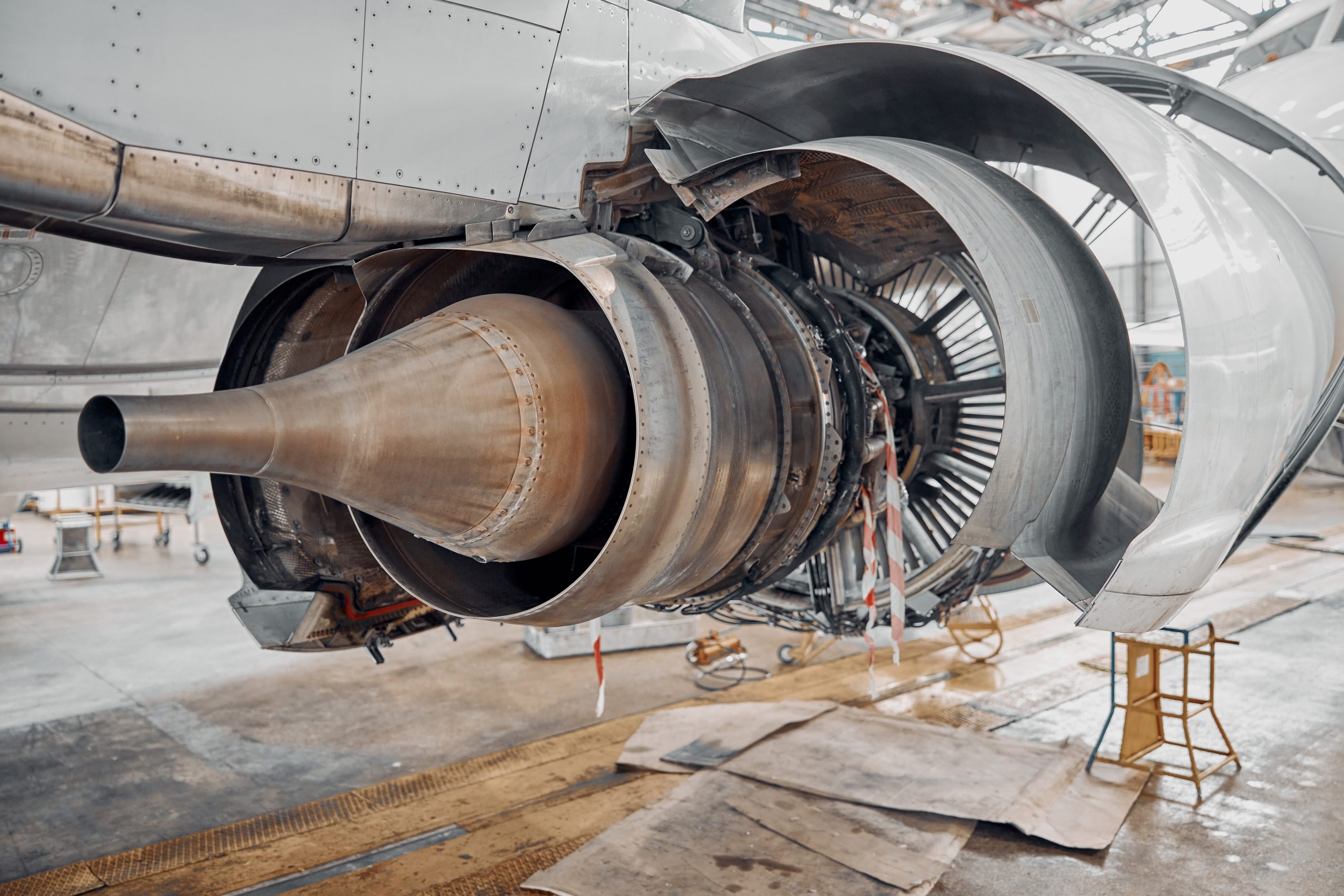 Aircraft engine undergoing maintenance in hangar