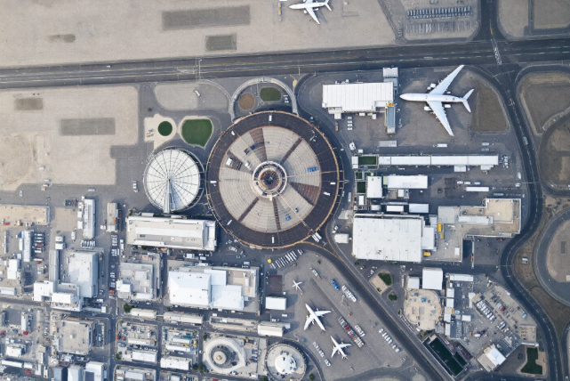 Aerial view of airport runway and terminal.